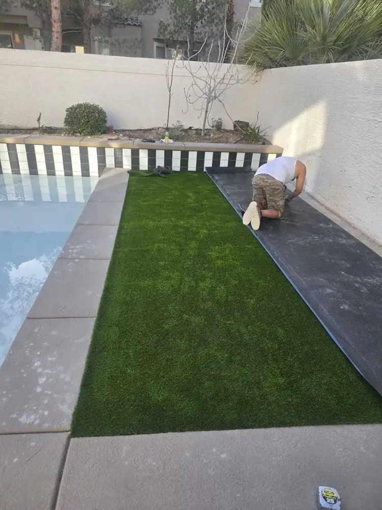 Narrow side yard with new artificial turf