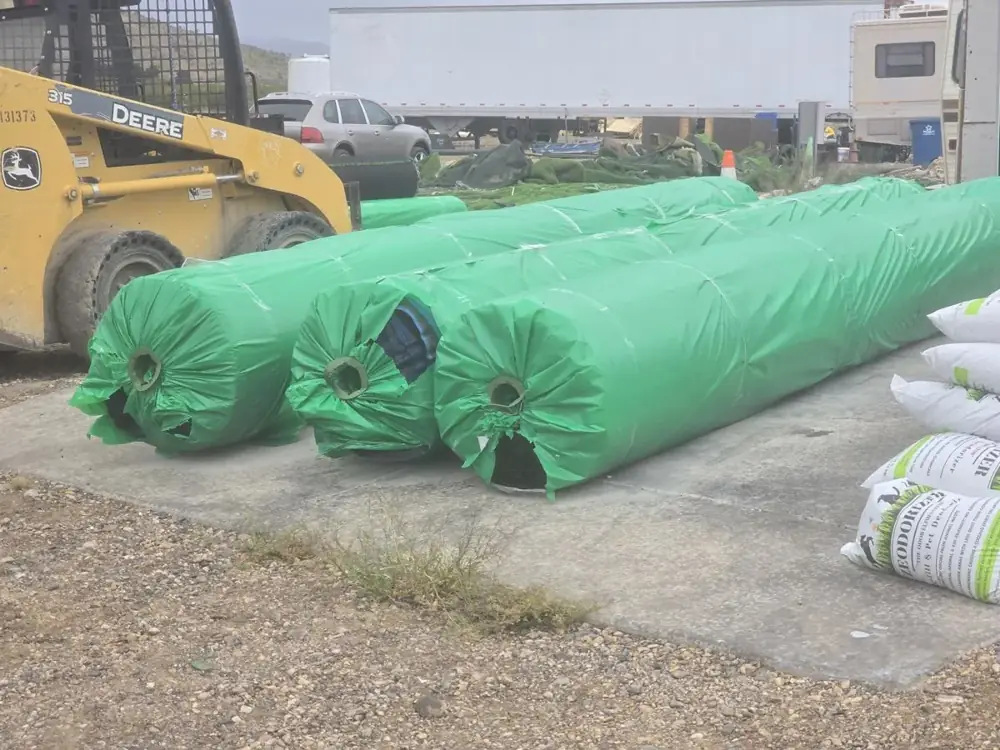 Turf rolls unloaded by skid steer